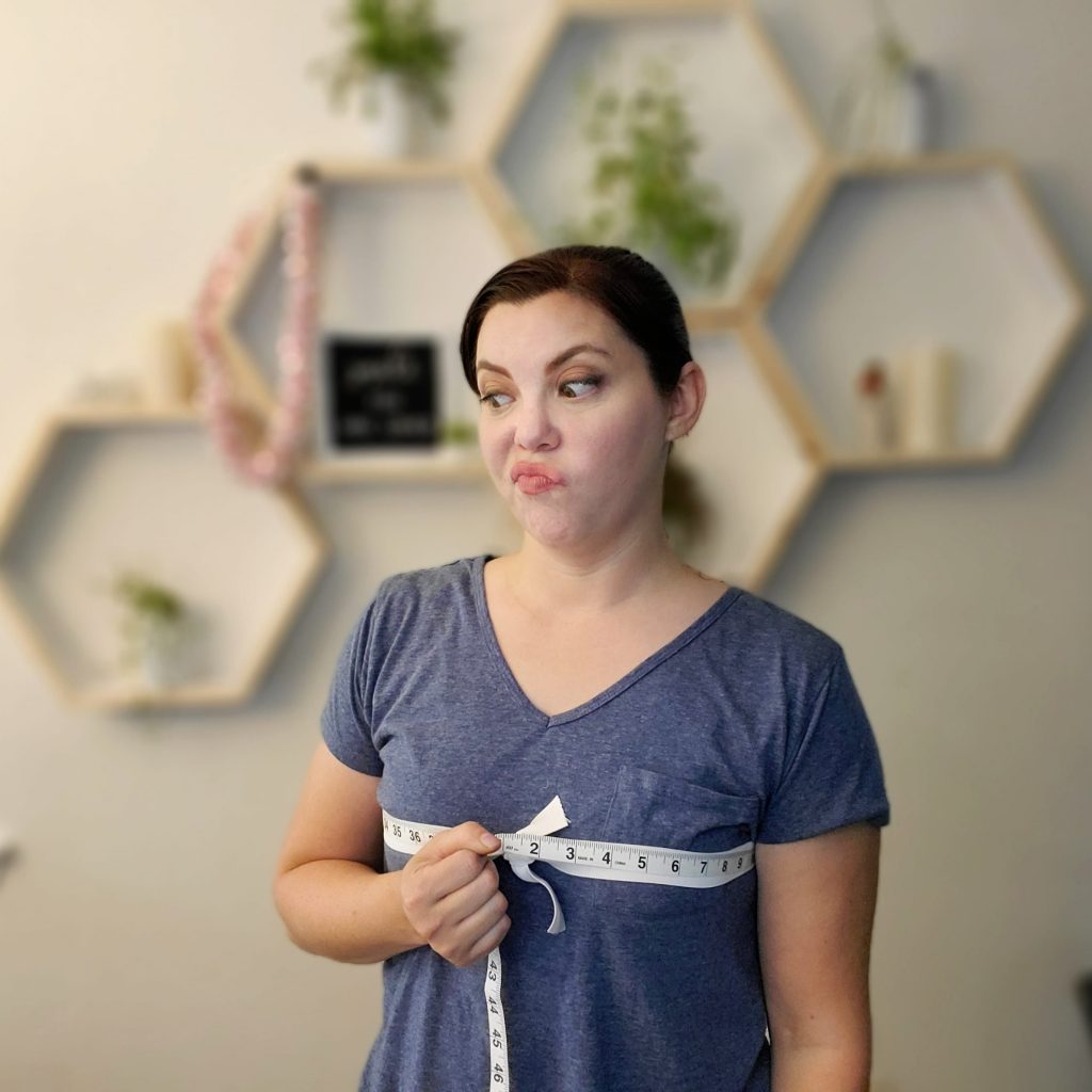woman taking fashion measurements