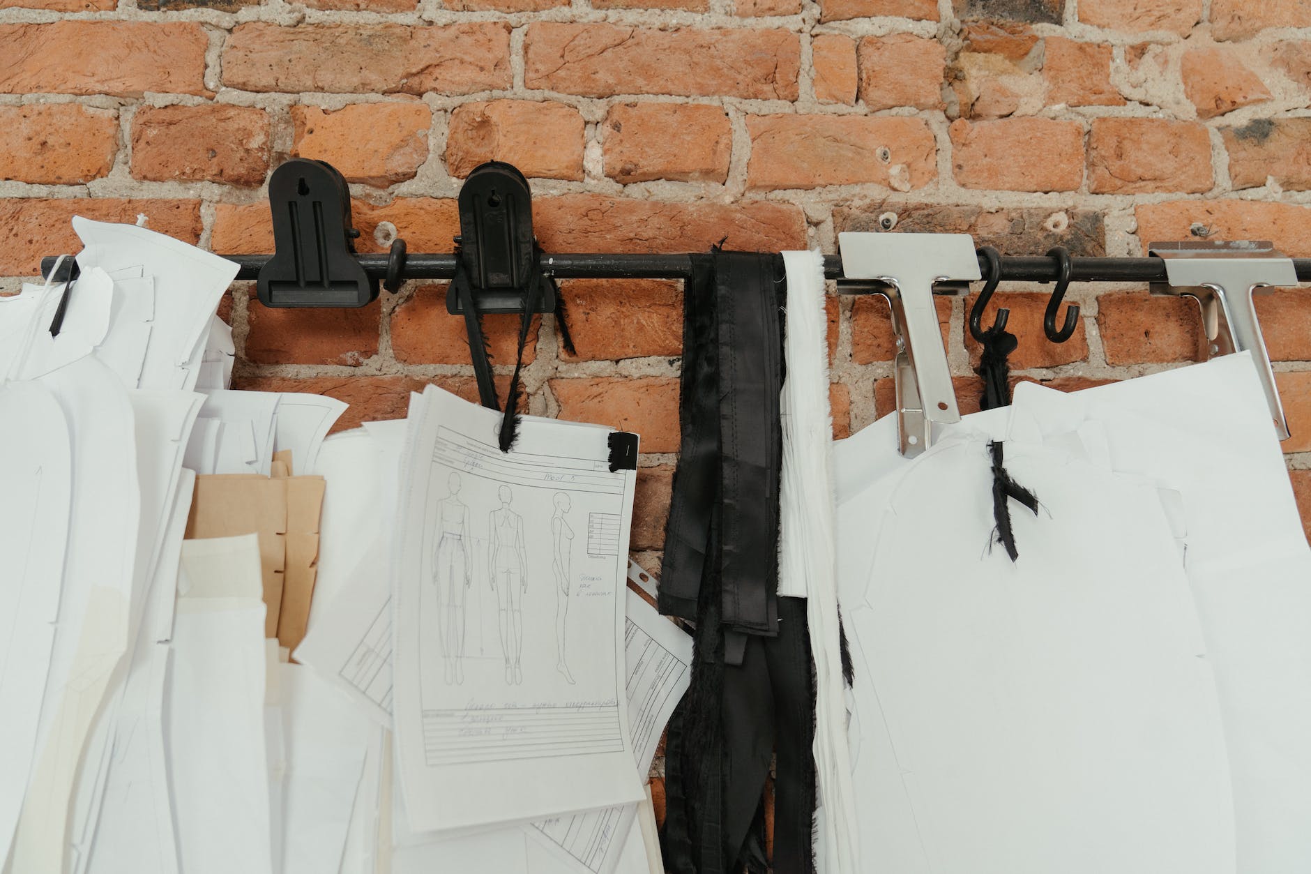 black sling bag on white printer paper